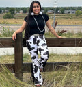 Cow print fringe pants