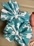 Teal Cowprint clip on pair